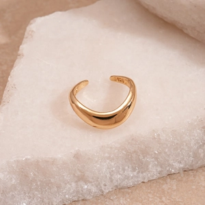 Close-up of S925 sterling silver hallmark on gold-plated irregular pleated ring