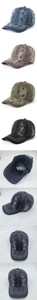 Detail of washed denim baseball caps with contrast stitching and numeric prints