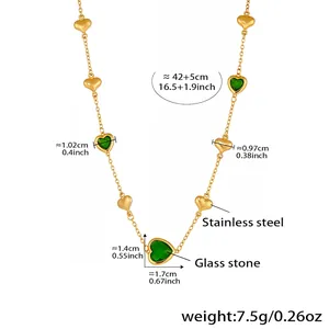 Detailed view of gold stainless steel necklace with green glass heart pendants