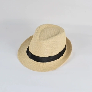 Detailed view of the woven texture and black ribbon band on a beige straw fedora hat