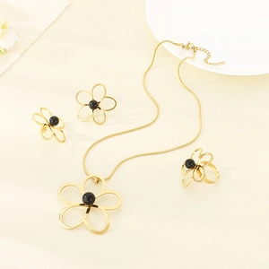 Parure de bijoux fleurs dorées avec perles noires collier boucles d'oreilles et bague