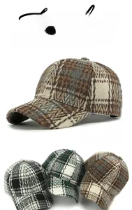 Close-up of vintage plaid pattern and wool texture on structured baseball caps