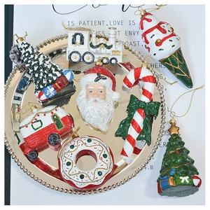 Detailed view of creative Christmas tree ornaments with glitter and festive red green motifs