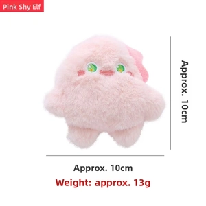 Pink plush monster hairbrush accessory with embroidered eyes and 10cm compact size
