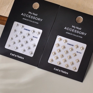 Elegant gold and silver square frame pearl nail stickers in minimalist packaging
