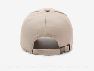 Rear view of beige baseball cap featuring textured fabric and metal adjustable buckle