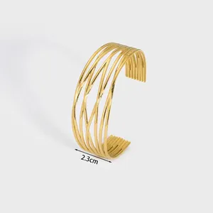 Close-up of golden multi-strand lattice cuff bracelet showing 2.3cm width and 14.4g weight