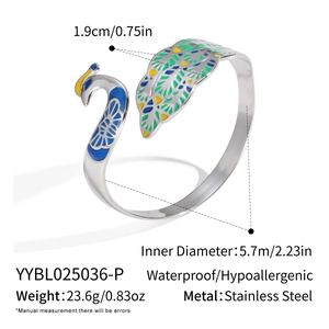 Detail showing dimensions of peacock enamel cuff in stainless steel and 18K gold