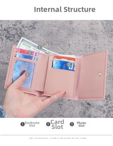 Internal layout of pink tri-fold wallet showing bill slot and multiple card holders