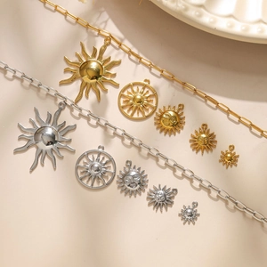 Golden and silver stainless steel sun pendants with hollow patterns and smiling faces