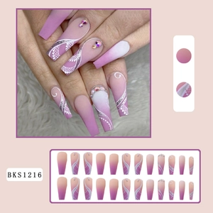Pink and purple gradient press-on nails with lace patterns and rhinestone accents