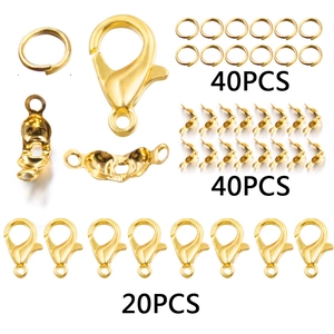 100pcs golden DIY jewelry making set including lobster clasps and jump rings on white background