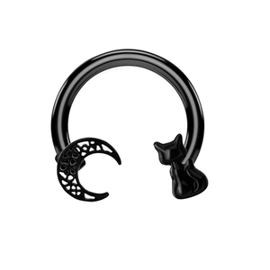 Detail of black stainless steel nose ring with a hollow crescent moon and a black cat