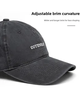 Dettaglio della visiera curva su cappello vintage grigio scuro con ricamo COYENRAI