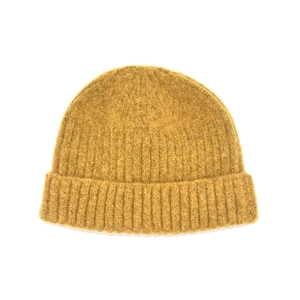 Detailed close-up of mustard yellow knitted beanie featuring vertical ribbed texture