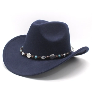 Dark blue felt cowboy hat with ethnic beaded band and silver charms on white background
