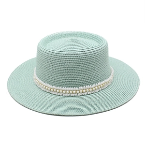 Mint green straw boater hat featuring elegant pearl and white lace ribbon decoration