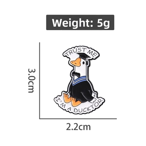 Cartoon white duck doctor enamel pin with Trust Me I'm a Ducktor text and measurements