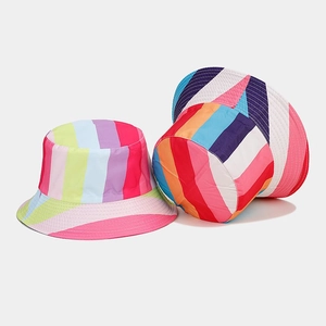 Detail view of double-sided bucket hat with vibrant multi-color rainbow stripes
