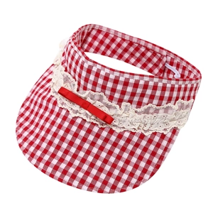 Red and white checkered pet sun hat with lace trim and bow on white background