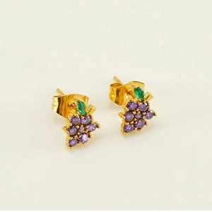Close-up of gold grape stud earrings featuring purple cubic zirconia and green leaves