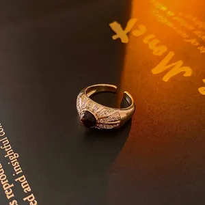 Vintage gold open ring with tiger eye stone and zircon accents in a retro style