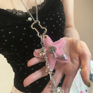 Pink denim star pendant necklace with silver charms and bow in a trendy Y2K aesthetic style