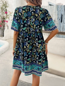Detailed back view of a high-waisted floral print summer dress with bohemian patterns