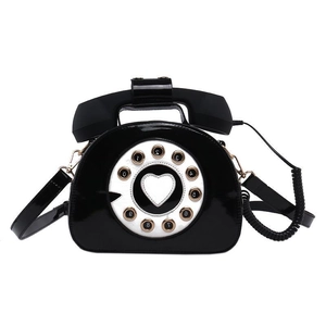 Creative retro black telephone shoulder bag with glossy patent leather and heart dial