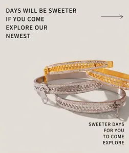 Close-up of gold and silver zipper-style bracelets with sparkling full crystal pavé