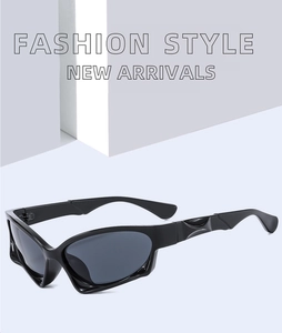 Detail of sleek black Y2K sports sunglasses with streamlined 3D embossed temple design