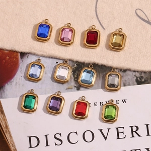 Detailed group view of colorful rectangular faceted gemstones in gold plated frames