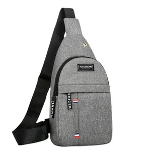 Detailed close-up of gray waterproof sling bag featuring the Fashion logo and zip texture