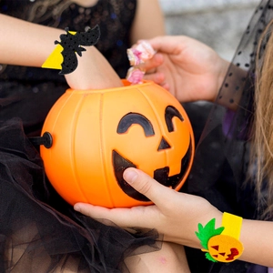 Halloween wrist slap bracelets with pumpkin and black bat motifs for kids party