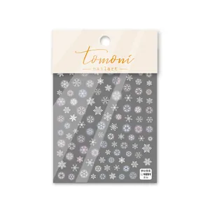 Detailed view of dreamy snowflake nail stickers featuring thin and tough adhesive texture