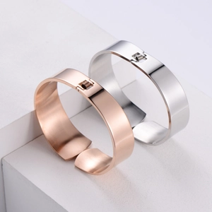 Minimalist wide metal bangle set in rose gold and silver finish with spring hinge