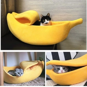 Detailed views of a banana-shaped yellow plush cat bed with cats resting inside it