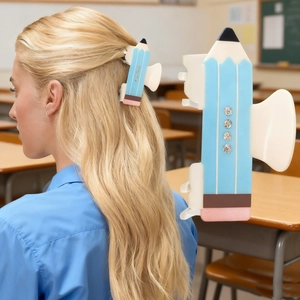 Pencil shaped hair claw clip with colorful rhinestones in a creative school style design