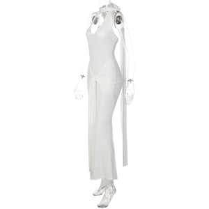 Detail view of white halter neck maxi dress featuring waist pleats and open back design
