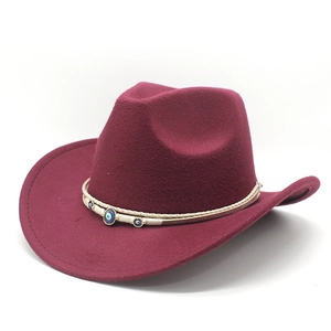 Close-up of wine red wool fedora hat featuring woven band and evil eye charm detail