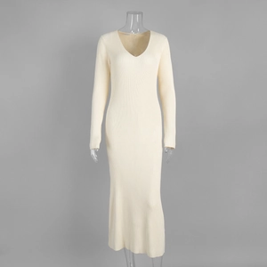 Detail view of the cream V-neck knit midi dress featuring a slim ribbed texture