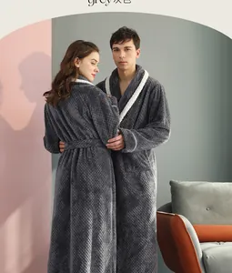 Detail of dark grey flannel bathrobe showing pineapple lattice texture and contrast piping