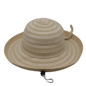 Detail view of woven striped sun hat texture with gray chin strap and adjustable bead