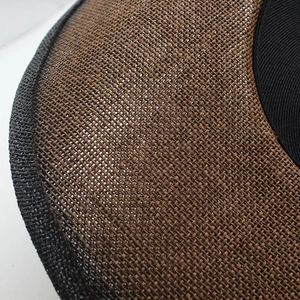 Close-up of dual-tone brown and black woven straw hat textures and craftsmanship