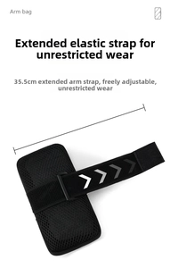 Detail of breathable mesh backing and 35.5cm elastic strap on black sports arm bag