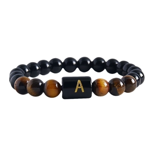 8mm natural tiger eye and obsidian beaded bracelet with gold letter A charm on white background