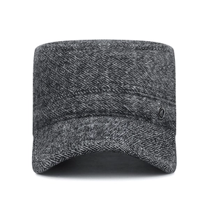 Winter grey herringbone flat top cap with ear protection and side metal badge