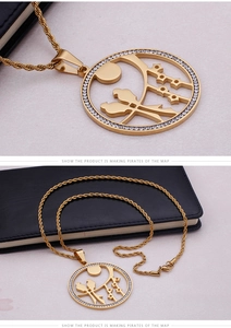 Detailed macro view of gold-plated titanium bird pendant set with sparkling zircons