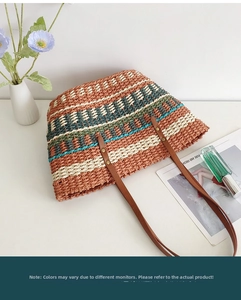 Close-up of Bohemian handwoven tote bag with colorful geometric stripes and leather straps