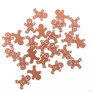 Brown gingerbread man Christmas ornaments with red bow ties on white background